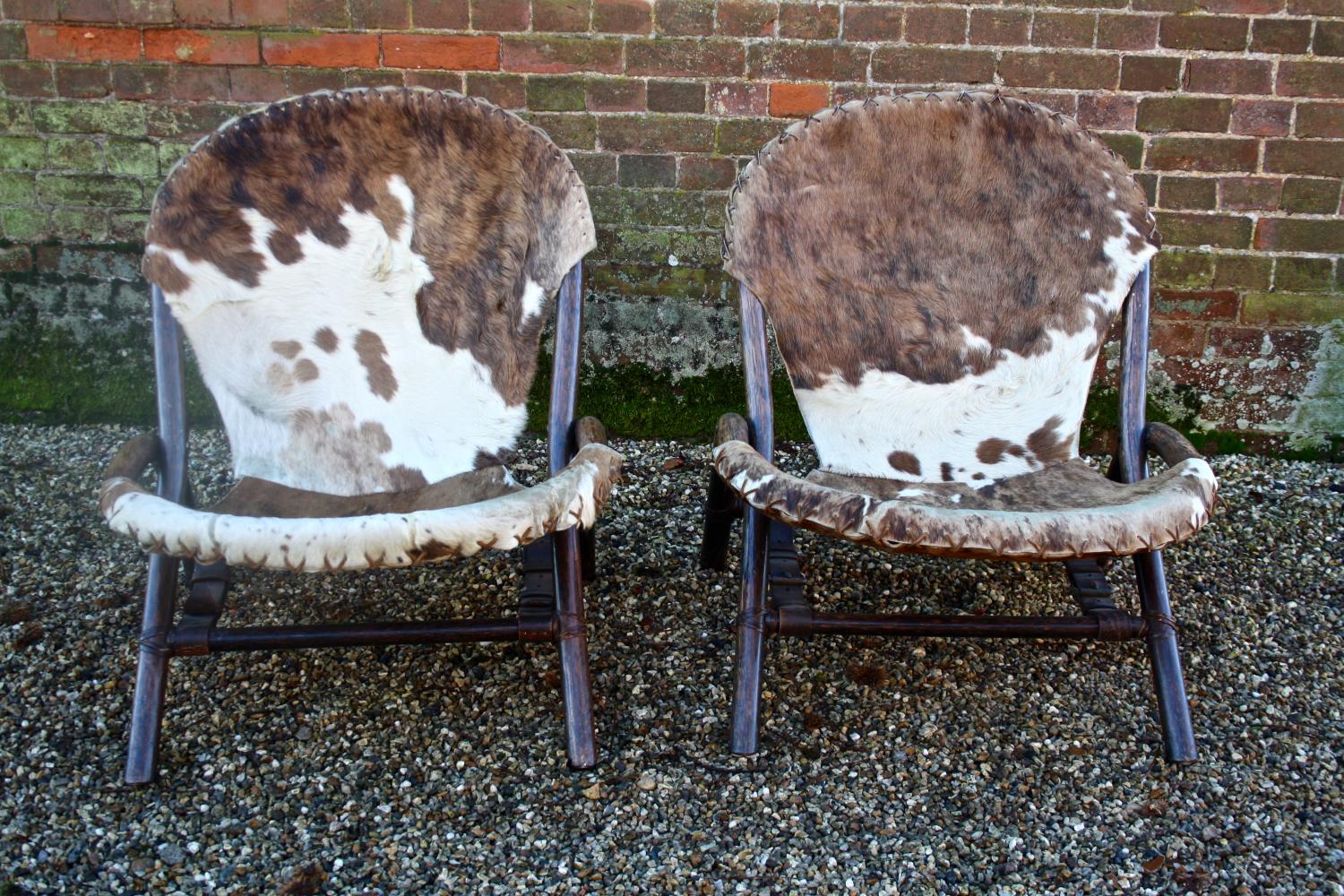 Pair of mid century bentwood cowhide chairs