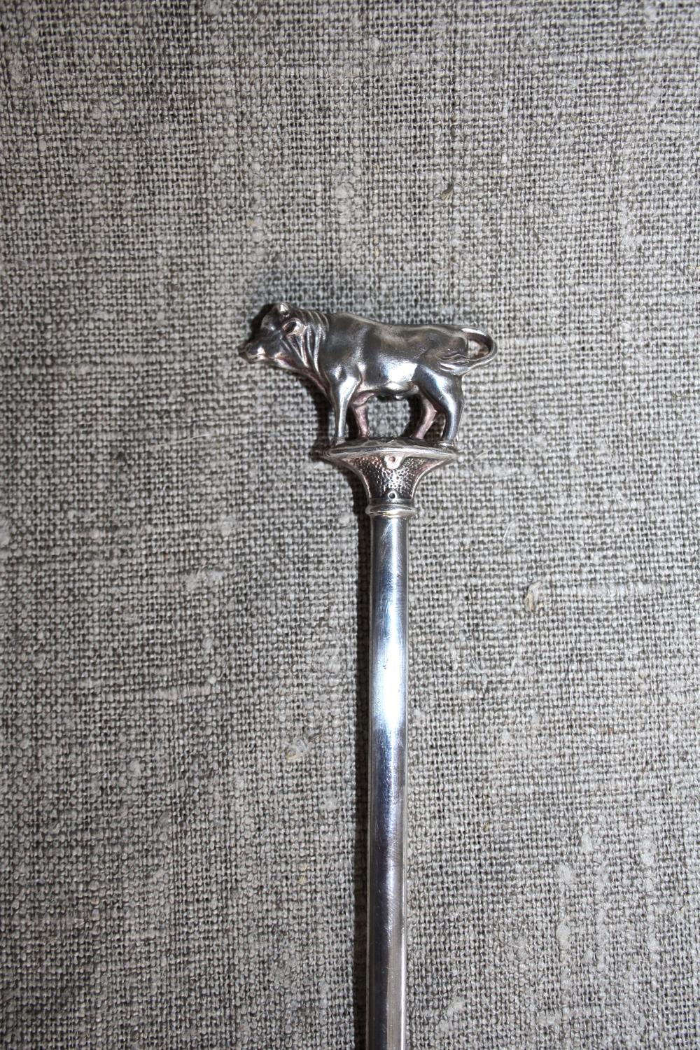 Silver plated meat skewer with bull