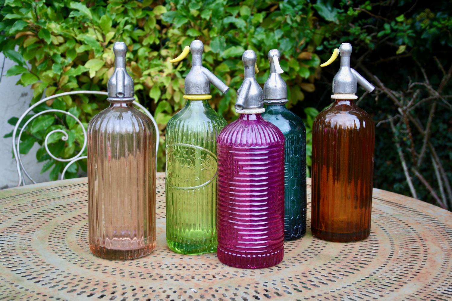 Coloured glass mid century soda bottles