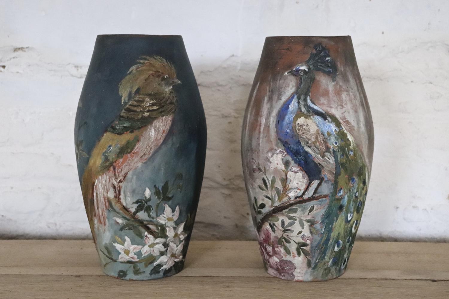 Pair of terracotta vases with birds