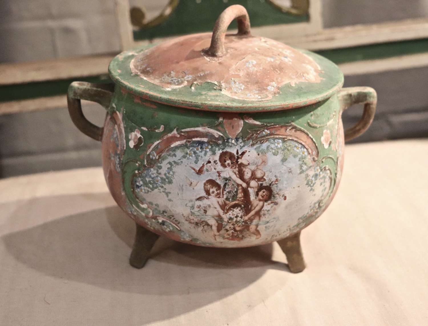 Terracotta pot with cherub decoration