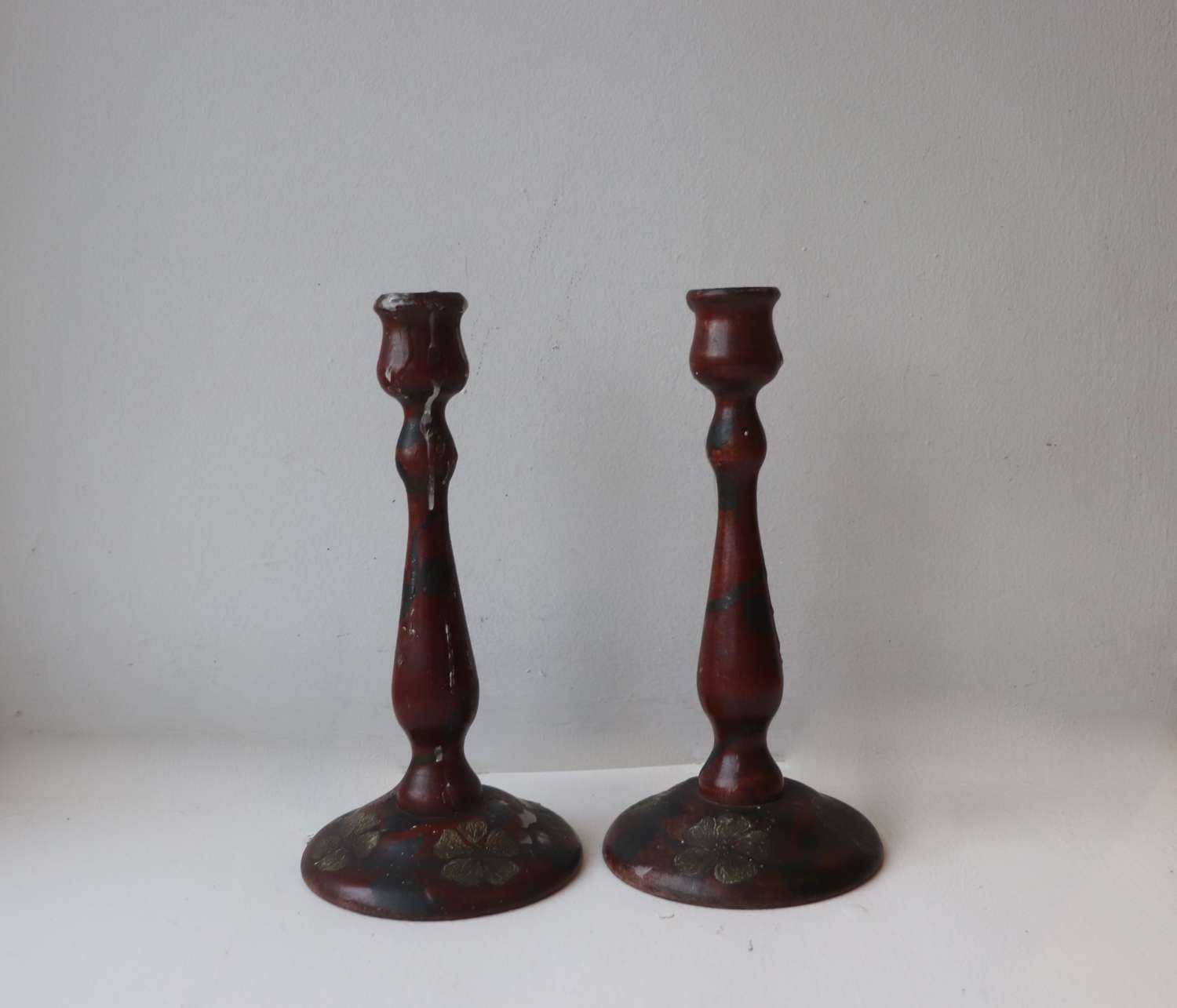 Pair of painted wooden candlesticks