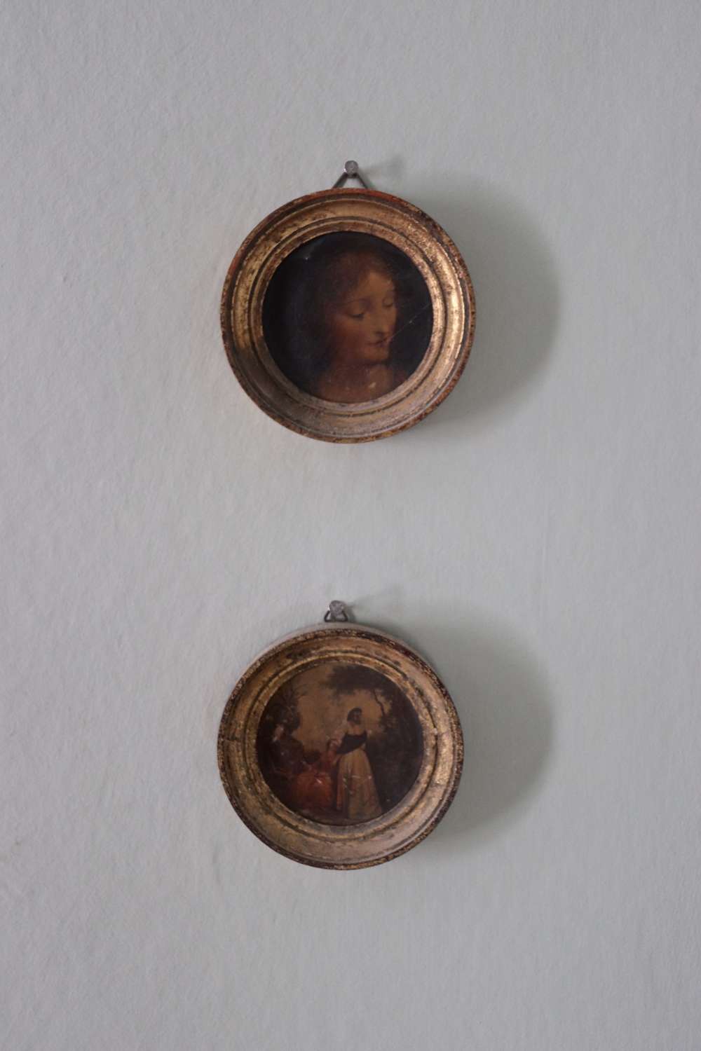Pair of late 19th century oils in small round gilt frames