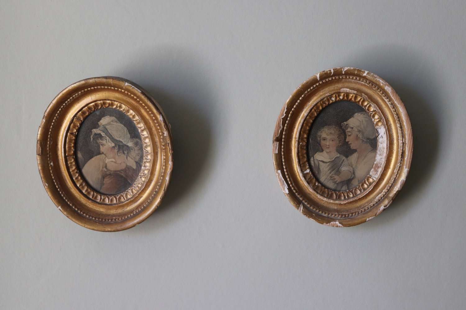 Pair of 19th century gilt frames with prints