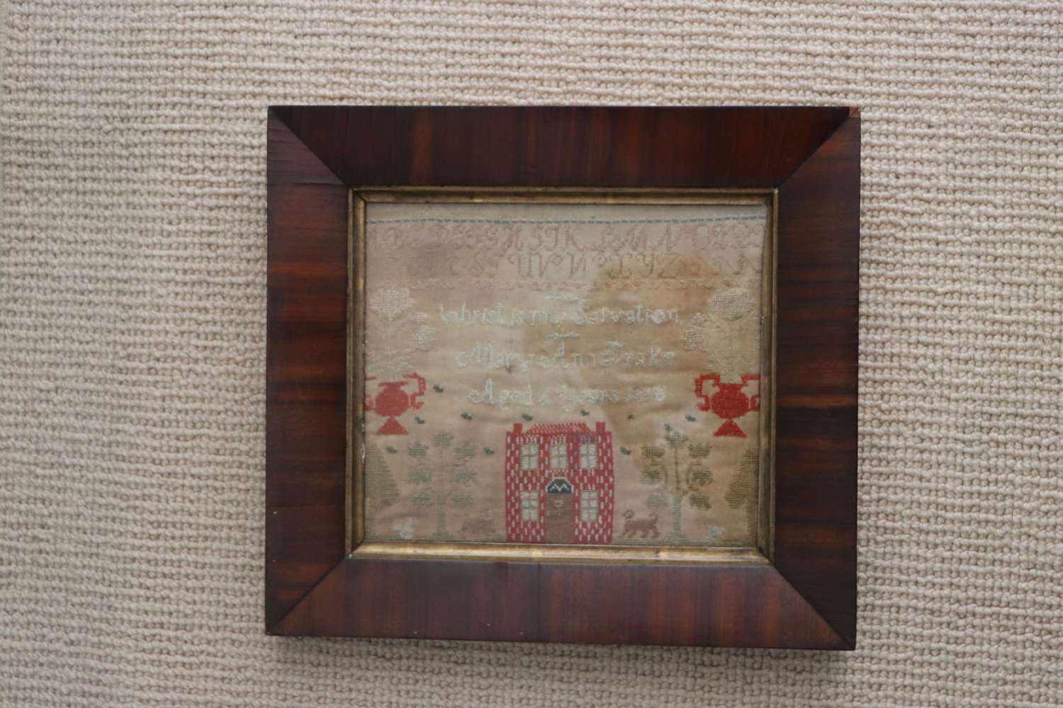 19th century sampler in rosewood frame