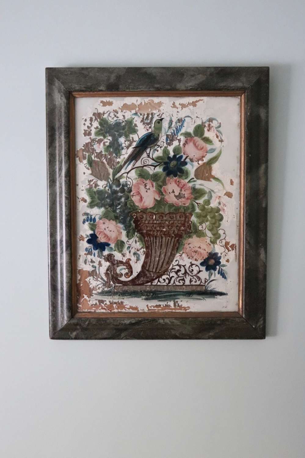 Pair of reverse glass painted pictures depicting birds and flowers
