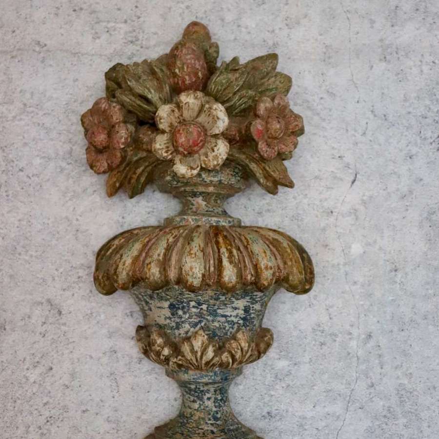 Victorian carving of flowers in an urn
