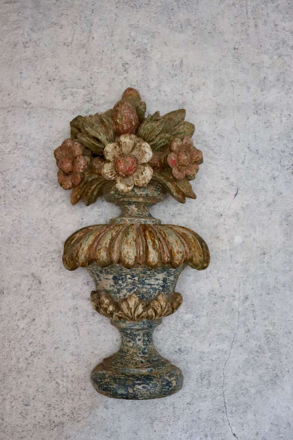 Victorian carving of flowers in an urn
