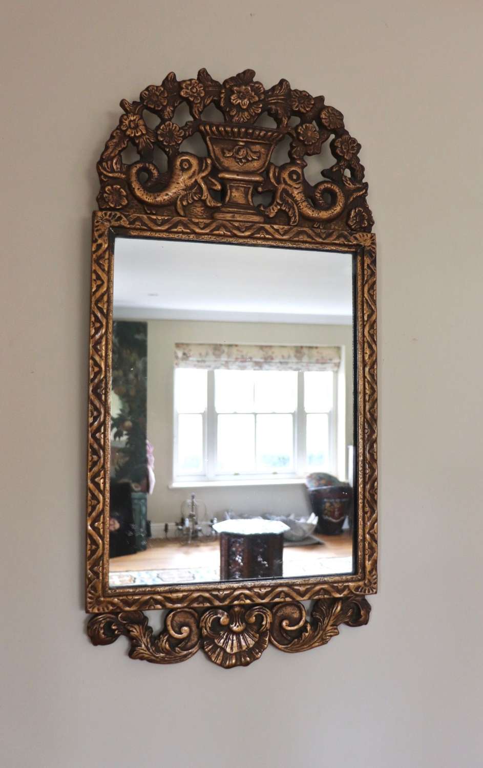 Early 20th century gilt mirror with dolphin carvings