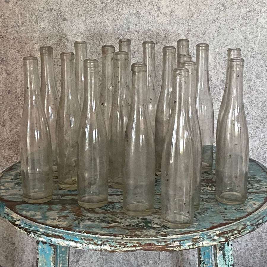 Eighteen French soda bottles