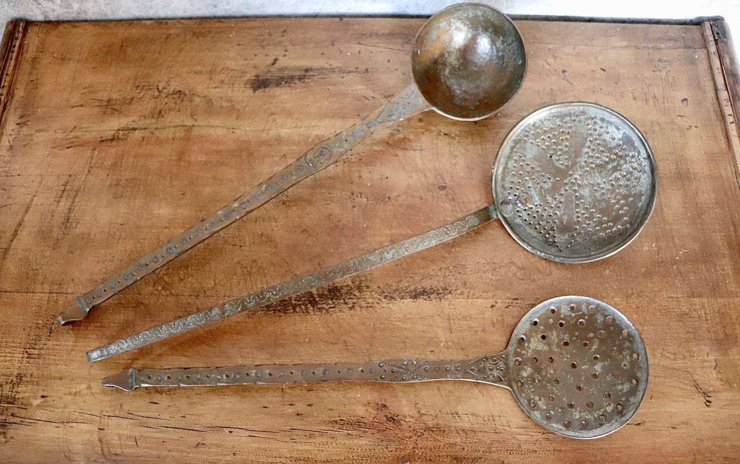 Two chestnut spoons and a ladle