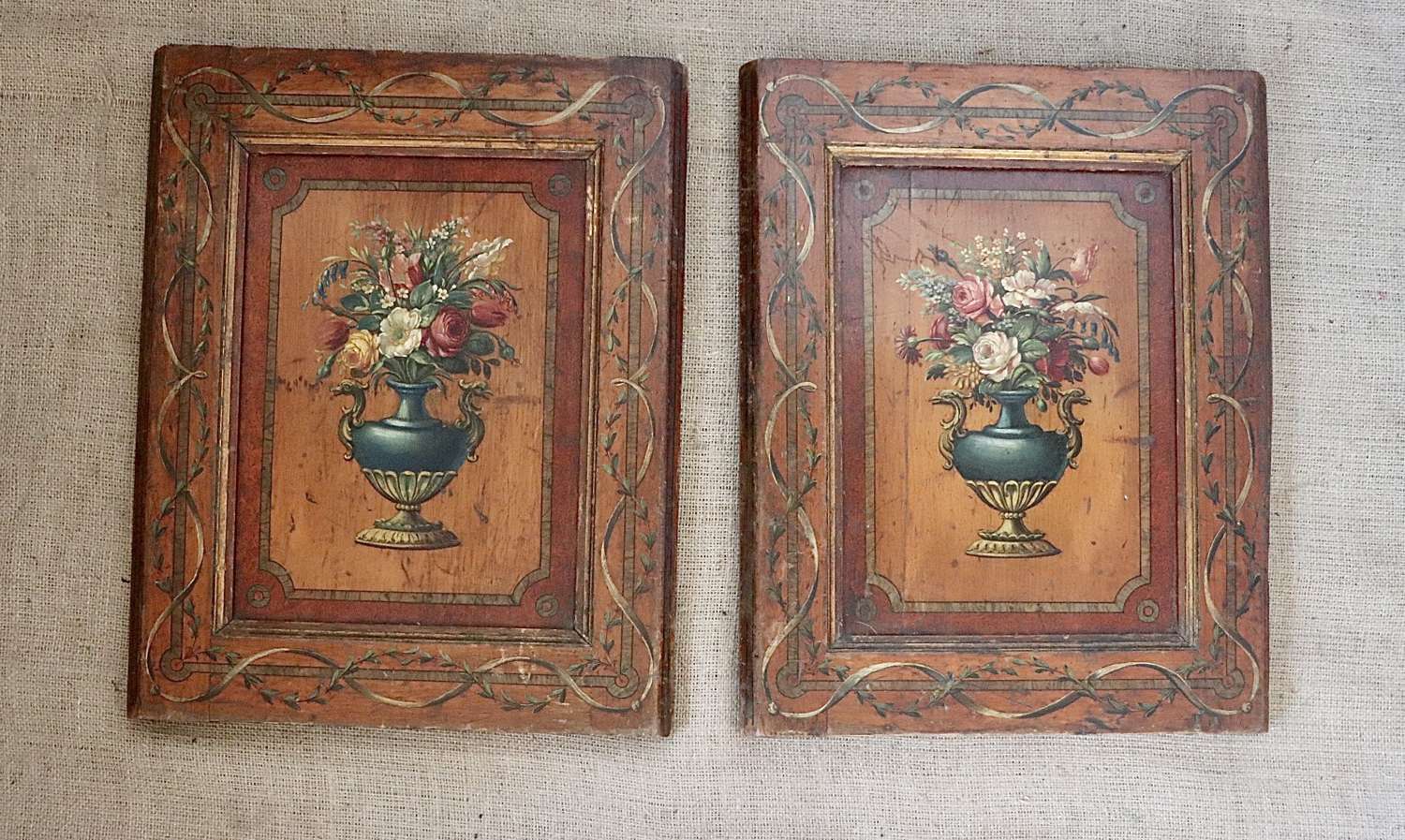 Pair of florally painted wooden panels